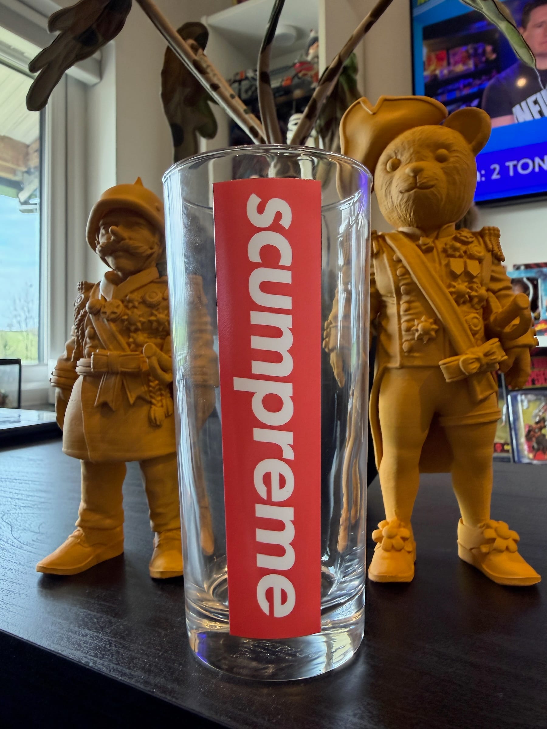 Supreme glass with wooden bear figurines wearing military uniforms