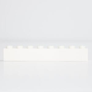 Single white LEGO® brick with ten studs on white background