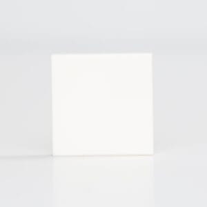 Plain white square tile sample on light grey background